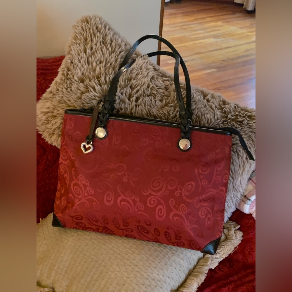 Brighton red swirl tote with black leather and braided handle.